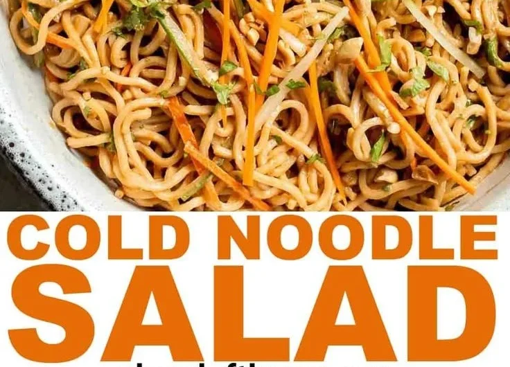 Delicious Asian cold noodle salad topped with fresh vegetables and sesame dressing.