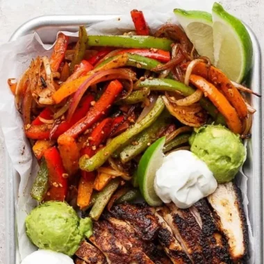 Sizzling Blackstone chicken fajitas with colorful bell peppers and onions