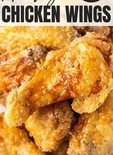 Crispy air fryer chicken wings served with dipping sauce and garnished with herbs