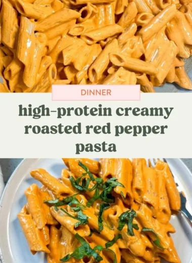 Bowl of high protein creamy roasted red pepper pasta topped with fresh herbs.