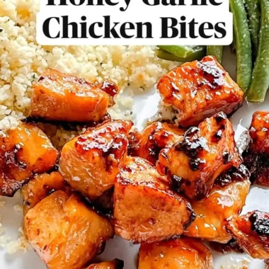 Delicious Honey Garlic Chicken Bites on a platter, garnished with green onions.