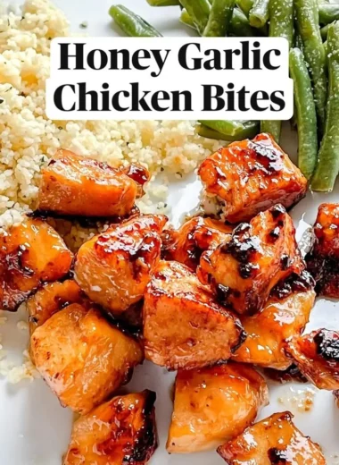 Delicious Honey Garlic Chicken Bites on a platter, garnished with green onions.