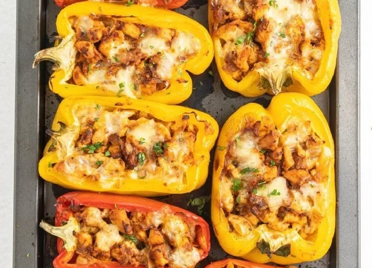 Healthy stuffed peppers recipe featuring chicken and vibrant vegetables.