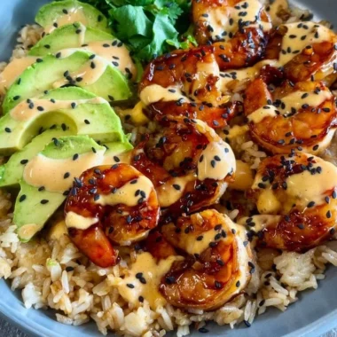 Delicious teriyaki shrimp rice bowl with vegetables and sauce