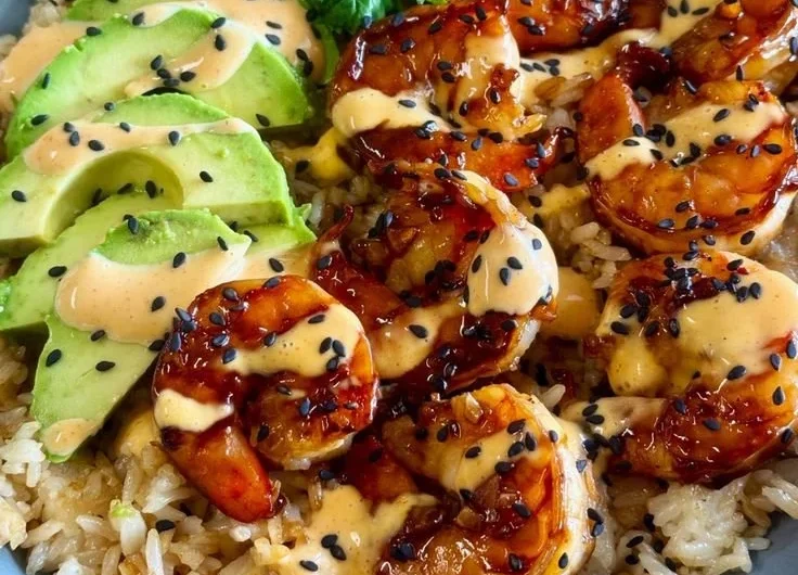 Delicious teriyaki shrimp rice bowl with vegetables and sauce