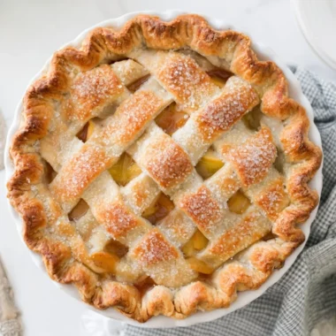 Delicious homemade apple pie with golden crust and fresh apple filling