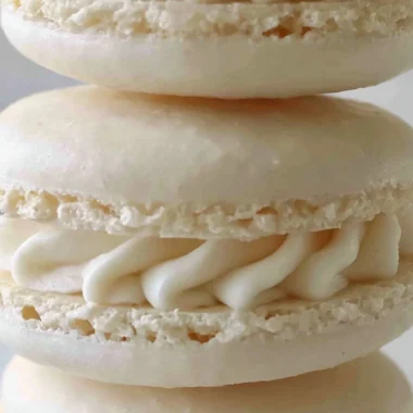 Aquafaba vegan macarons displayed on a plate, colorful and egg-free