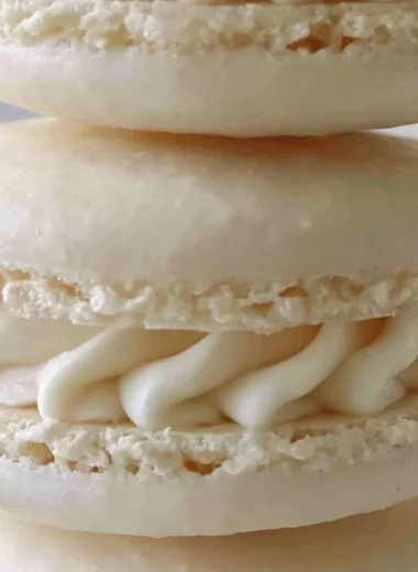 Aquafaba vegan macarons displayed on a plate, colorful and egg-free