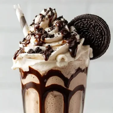 Bailey's Cookies and Cream Shake topped with whipped cream and cookie crumbles