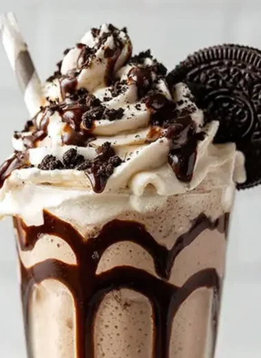 Bailey's Cookies and Cream Shake topped with whipped cream and cookie crumbles