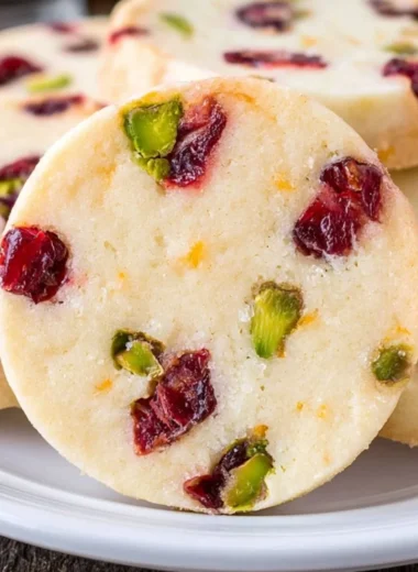 Delicious cranberry pistachio shortbread cookies on a rustic wooden surface
