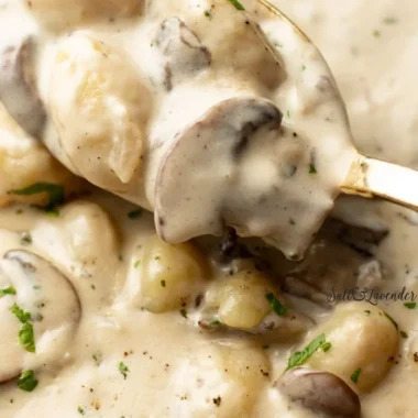Creamy Boursin gnocchi served in a bowl with herbs