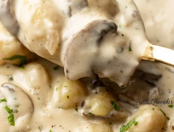 Creamy Boursin gnocchi served in a bowl with herbs