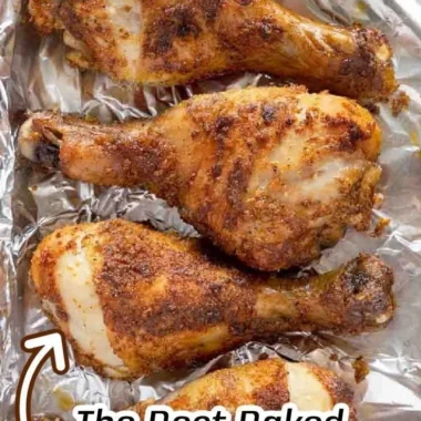 Crispy baked chicken legs ready to serve with garnishes.