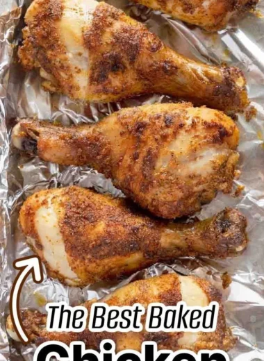 Crispy baked chicken legs ready to serve with garnishes.