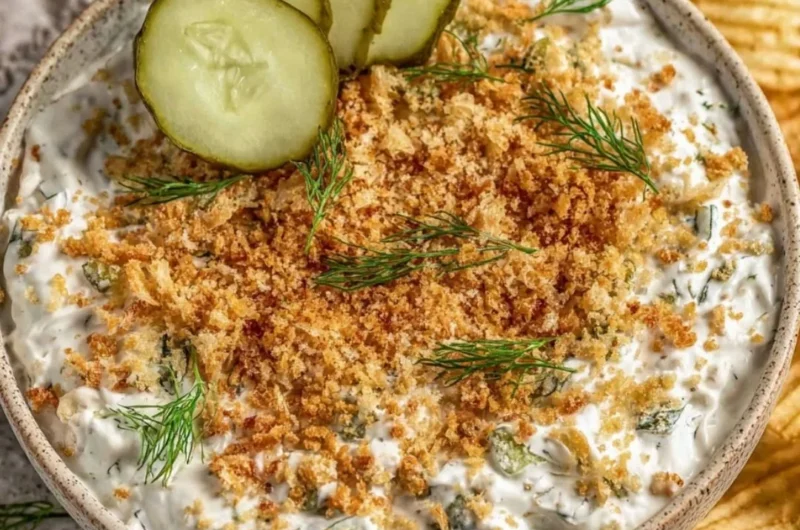 Delicious dairy-free fried pickle dip served in a bowl with chips