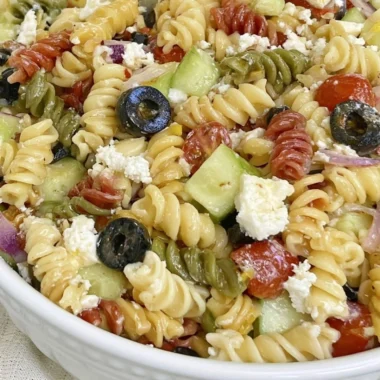 Bowl of easy Italian pasta salad with fresh vegetables and herbs