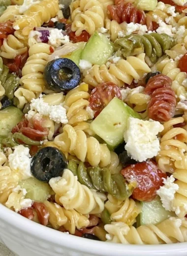 Bowl of easy Italian pasta salad with fresh vegetables and herbs