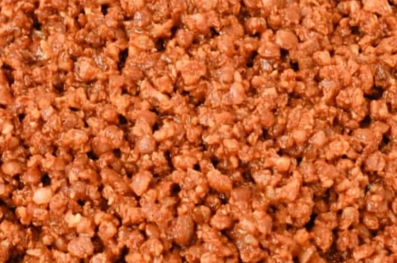 Bowl of easy lentil taco meat with toppings served in corn tortillas