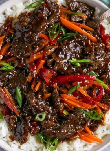 Delicious plate of easy Mongolian Beef served with rice and vegetables