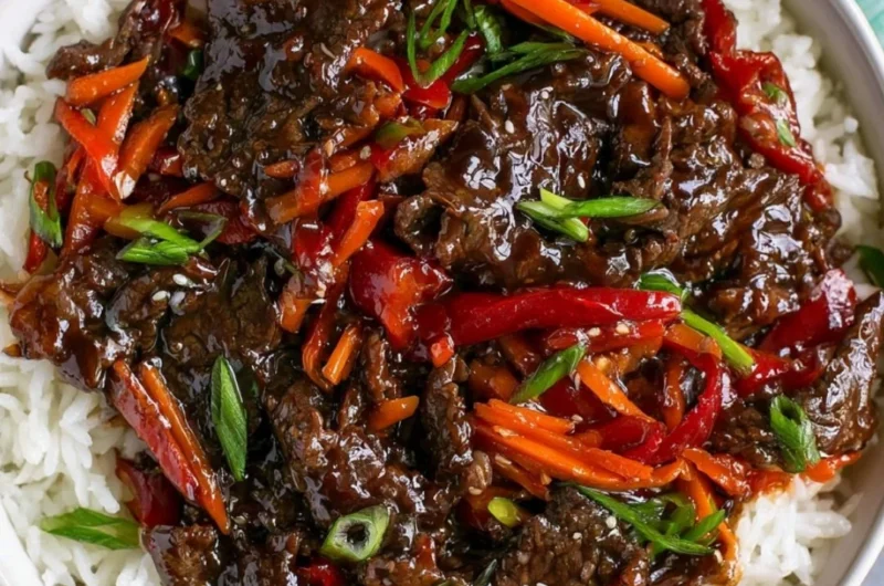Delicious plate of easy Mongolian Beef served with rice and vegetables