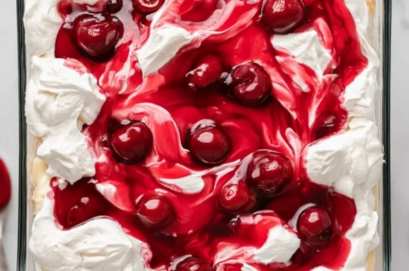 A slice of Heaven on Earth Cake with creamy layers and fruit topping