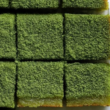 Delicious matcha mochi brownies with a chewy texture and vibrant green color.