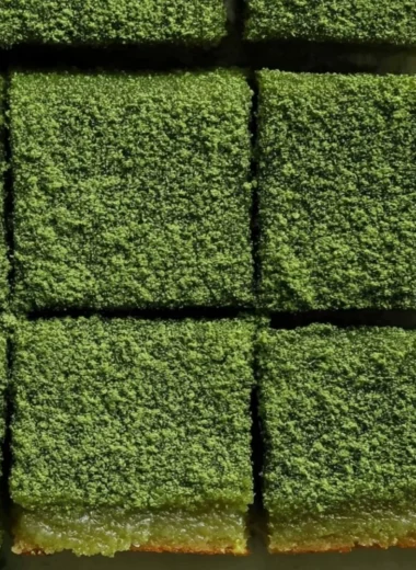 Delicious matcha mochi brownies with a chewy texture and vibrant green color.