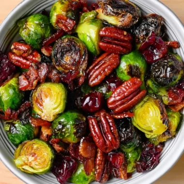 Roasted Brussels sprouts with bacon, pecans, and cranberries in a dish