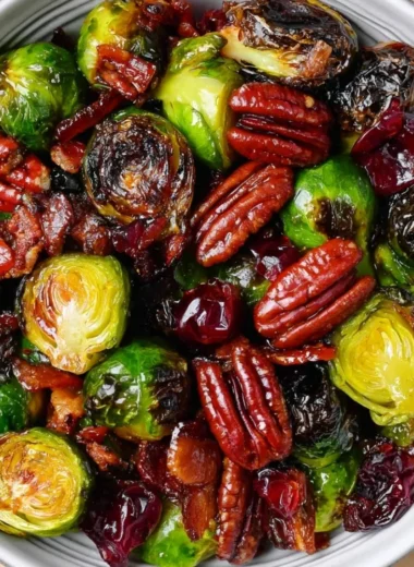 Roasted Brussels sprouts with bacon, pecans, and cranberries in a dish
