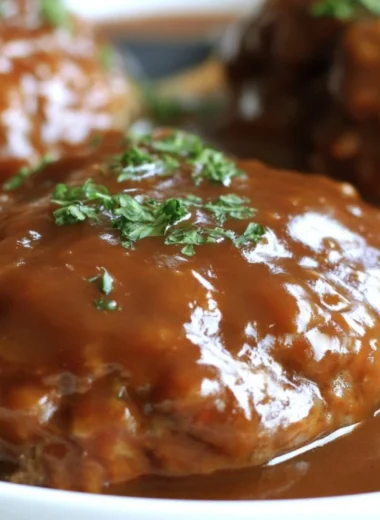 Homemade Salisbury Steak served with gravy and mashed potatoes