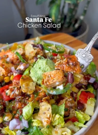 Colorful Santa Fe Salad with fresh ingredients and toppings in a bowl