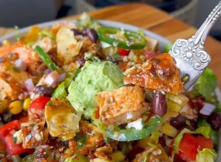 Colorful Santa Fe Salad with fresh ingredients and toppings in a bowl