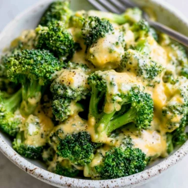 Delicious bowl of cheesy broccoli ready to be served