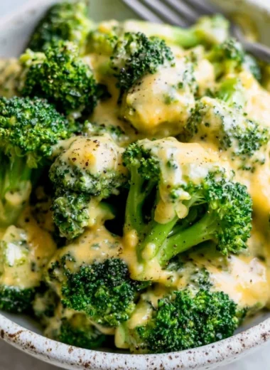 Delicious bowl of cheesy broccoli ready to be served