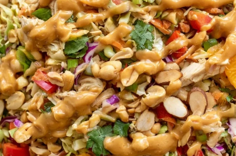 Delicious cozy Thai chicken salad with fresh vegetables and herbs