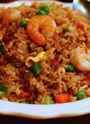 Plate of Asian restaurant-inspired fried rice with vegetables and shrimp
