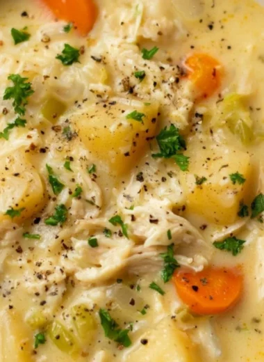 Delicious bowl of Chicken Pot Pie Soup with vegetables and flaky crust