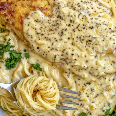 Cozy Crock Pot Angel Chicken dish served in a bowl with herbs.