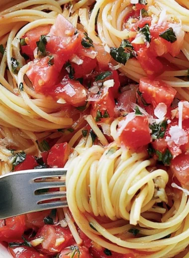 Cozy pasta served with fresh tomato sauce and basil