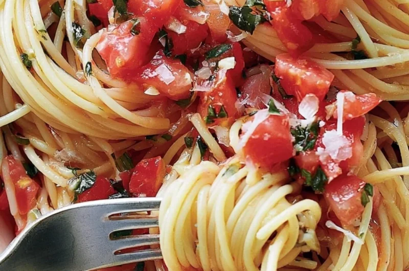 Cozy pasta served with fresh tomato sauce and basil