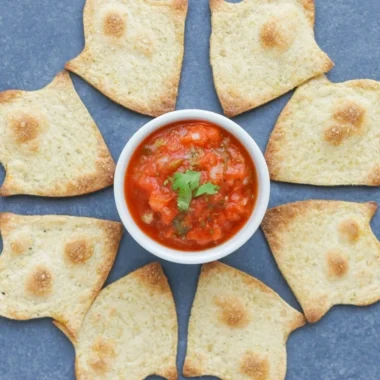 A bowl of baked Halloween chips in spooky shapes, ideal for festive snacking.