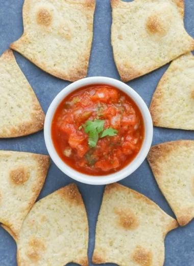 A bowl of baked Halloween chips in spooky shapes, ideal for festive snacking.