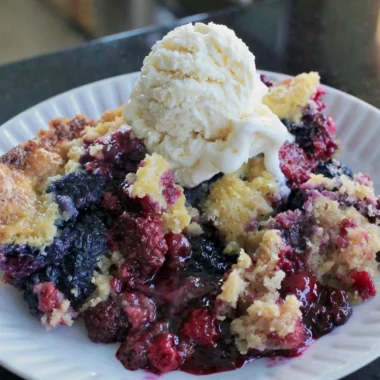 Delicious easy blackberry dump cake made with fresh berries on a table.