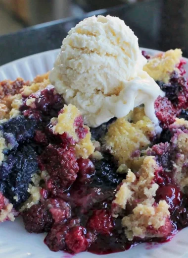 Delicious easy blackberry dump cake made with fresh berries on a table.