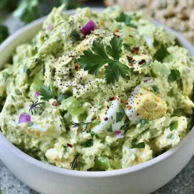 Herby avocado egg salad in a bowl, perfect for a quick lunch option.