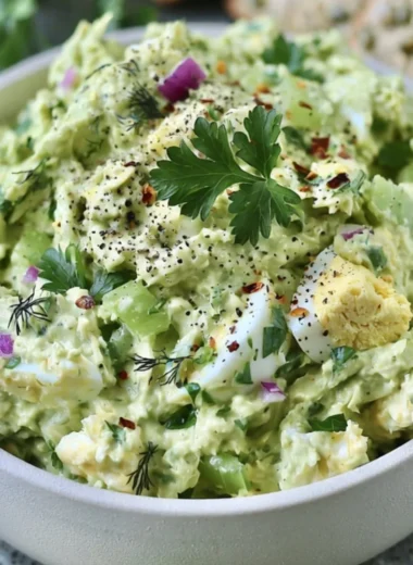 Herby avocado egg salad in a bowl, perfect for a quick lunch option.