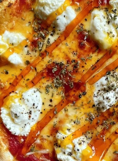 Slice of hot honey ricotta pizza drizzled with honey