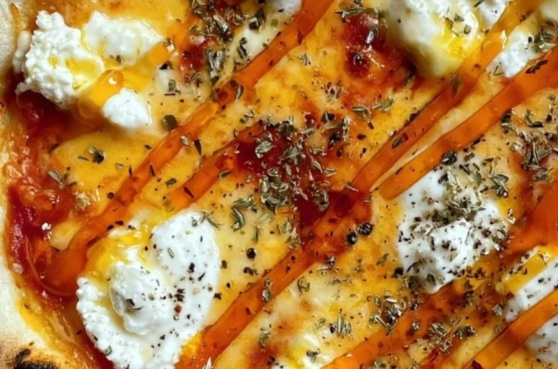 Slice of hot honey ricotta pizza drizzled with honey
