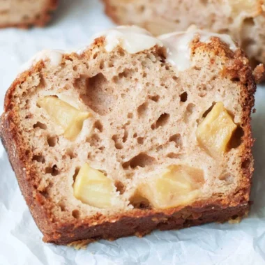 Freshly baked sourdough apple bread with chunks of apple and a golden crust.